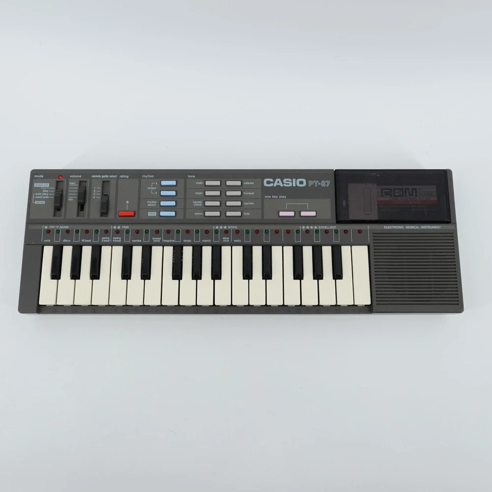Vintage Casio PT-87 Mini Keyboard & ROM Pack RO-551 World Songs TESTED & WORKING